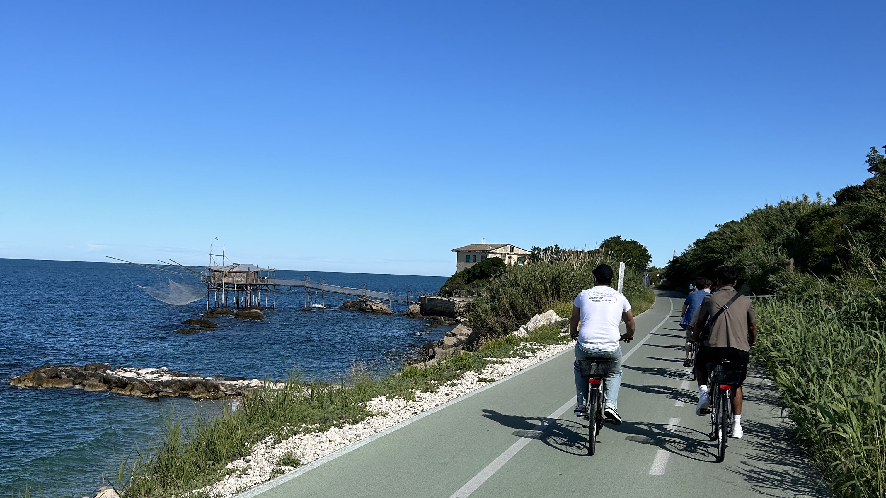 By the sea 3 Cyclist on a road by the Adriatic Sea.