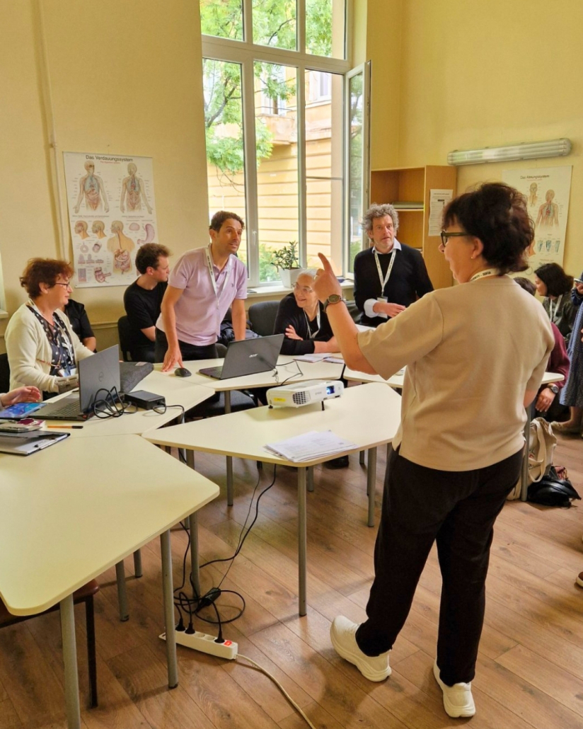 Tiina Luukkainen in front of the Staff Academy participants
